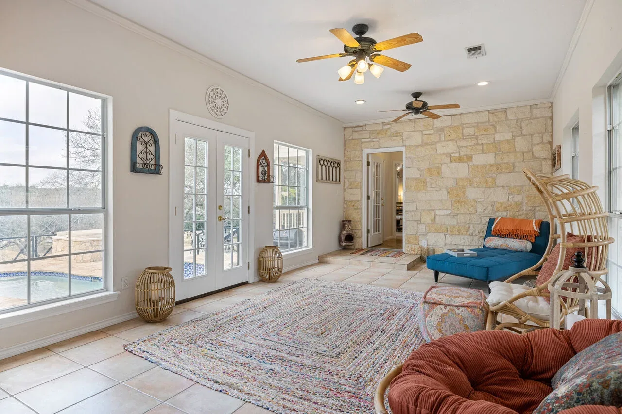 Bright sunroom styled with flexible guest seating