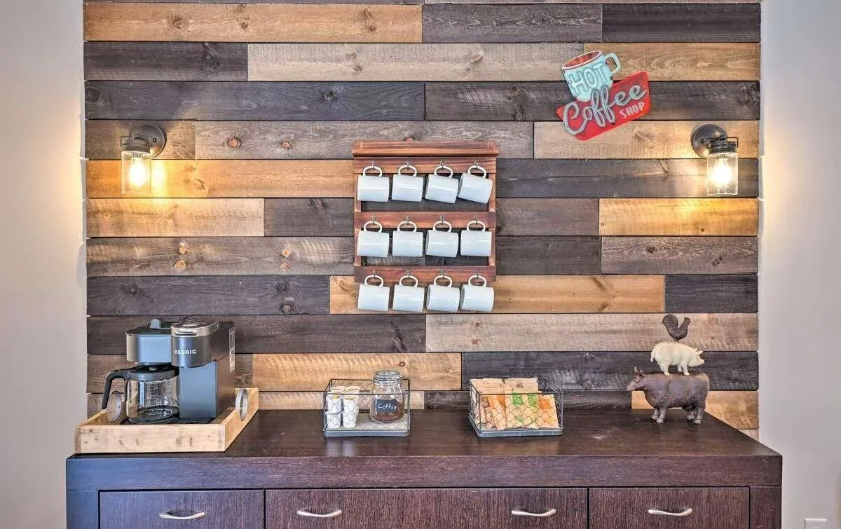 Poconos coffee bar with reclaimed wood feature wall and guest beverage station