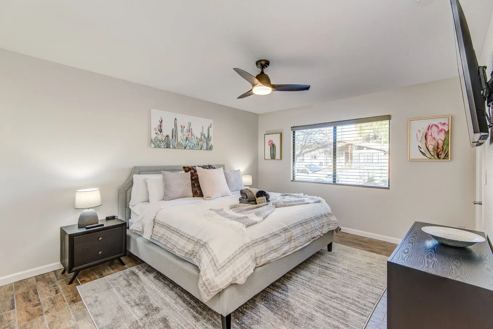 Sedona king bedroom with soft neutral styling and cactus artwork