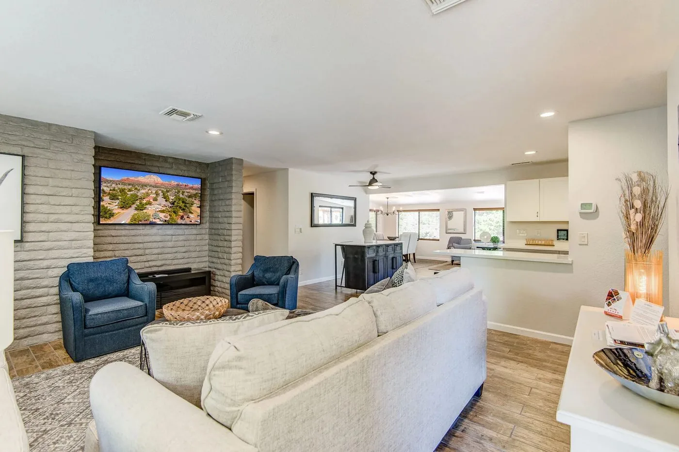 Sedona living space after: opened-up layout, island seating, light styled furnishings